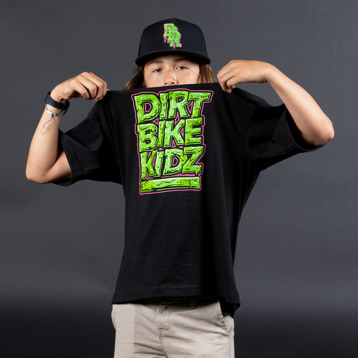 Youth black T-shirt with DIRT BIKE KIDZ front graphic worn by model
