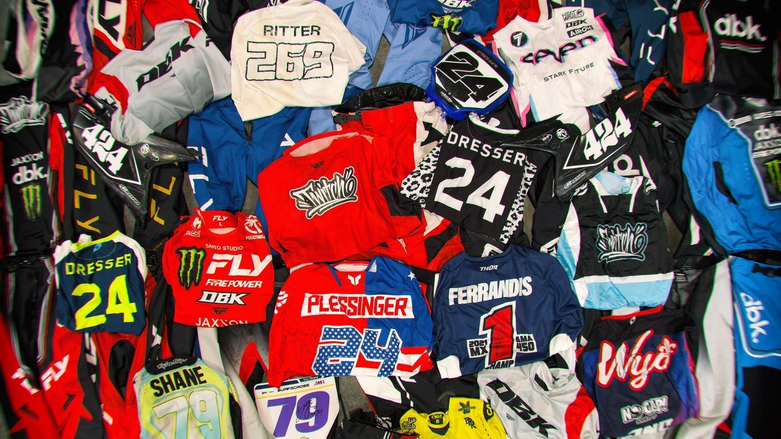 Pile of autographed motocross gear for the DBK Labor Day Sale giveaway