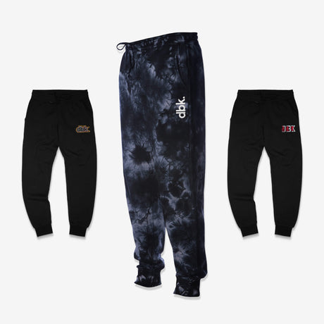DBK sweatpants in black and tie-dye, three styles shown front view, motocross lifestyle bottoms