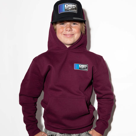 Youth maroon hoodie with hood up and small DBK logo patch on left chest
