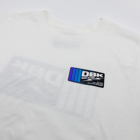 Youth premium tee chest logo close-up, white with blue DBK design
