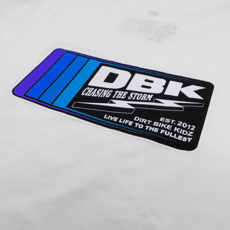 Youth premium tee logo graphic close-up, white with DBK text and stripes
