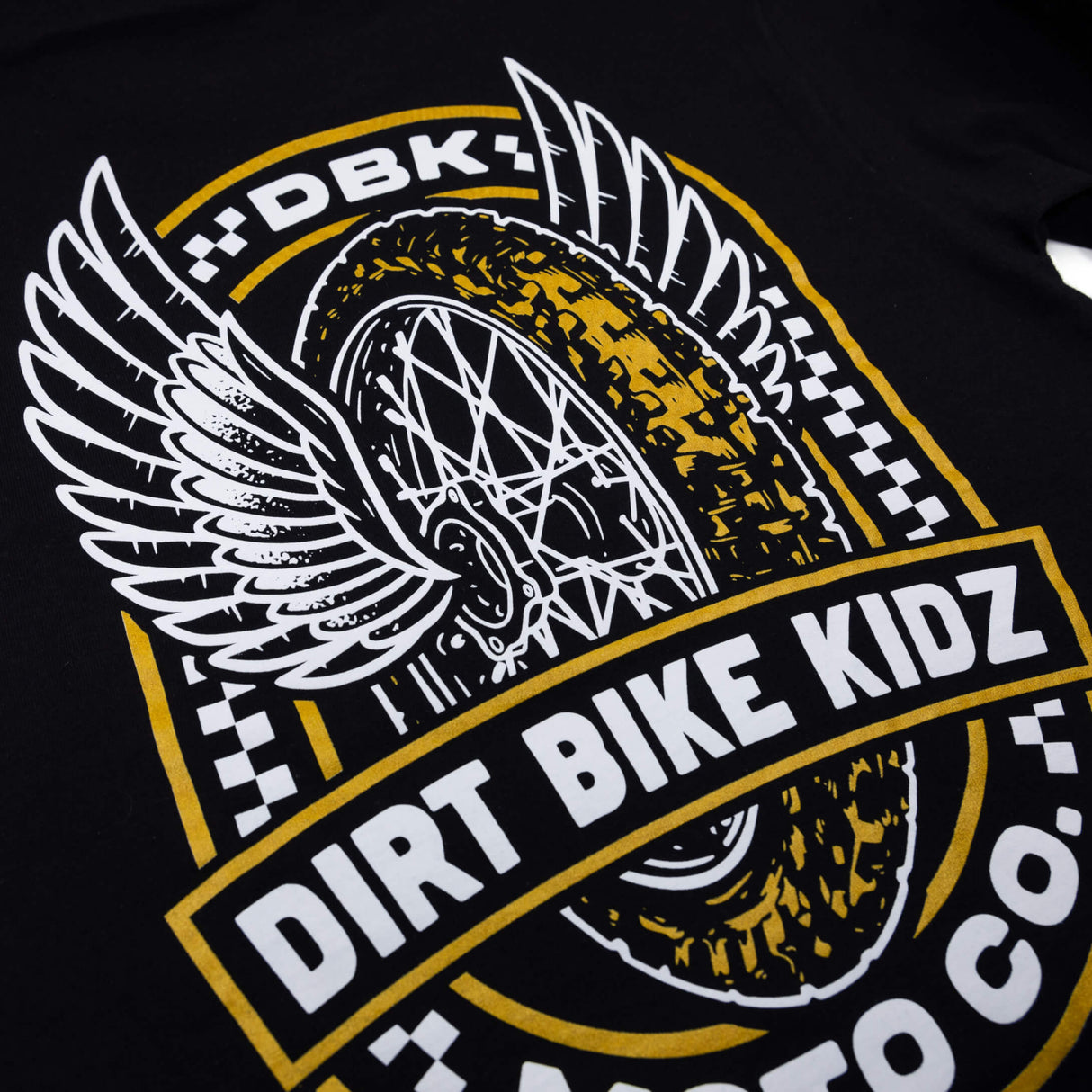 Youth premium black tee close-up of Dirt Bike Kidz Moto Co logo artwork.