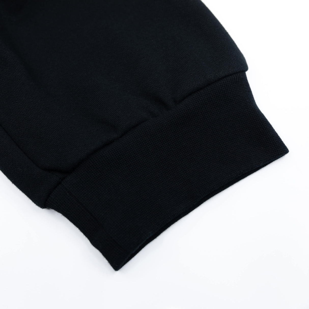 Black premium sweatpants cuff detail with ribbed hem and relaxed fit