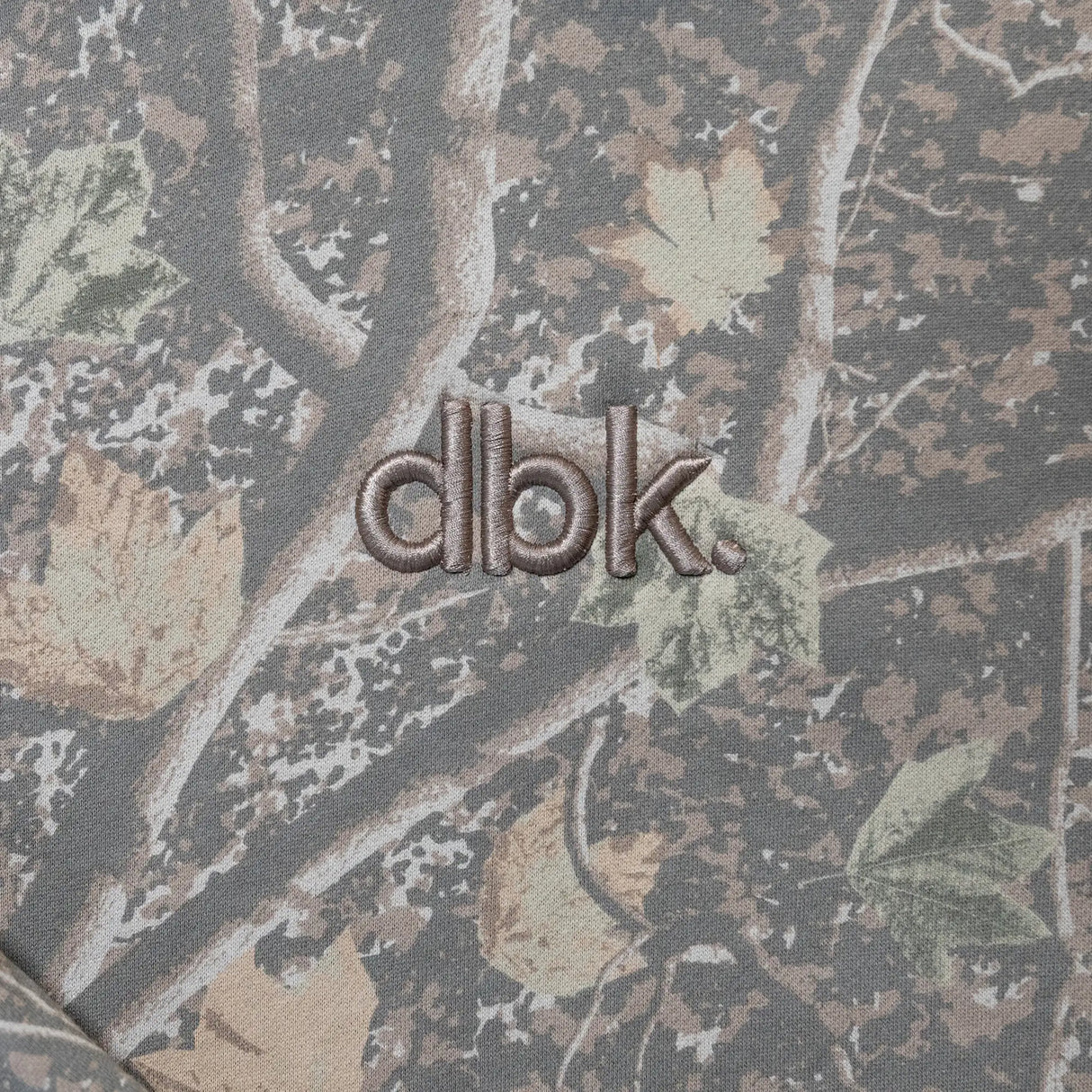 Youth camouflage hoodie chest logo patch with dbk embroidery.