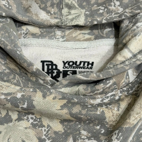 Youth camouflage hoodie neck label showing “YOUTH OUTERWEAR” branding.