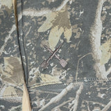 Youth camouflage hoodie sleeve seam with drawstring eyelets and drawcord.
