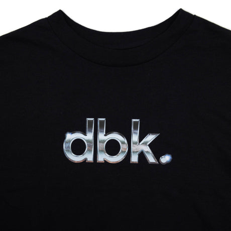 Black crewneck T-shirt neckline with large metallic silver dbk logo lettering.