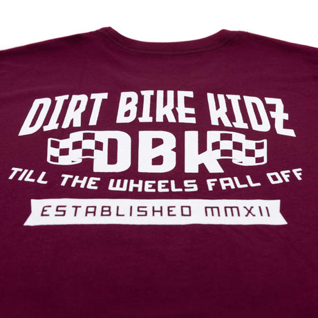 Burgundy T-shirt close-up of large back DBK print with “Till the Wheels Fall Off”