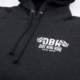 Kids dark hoodie close-up showing hood drawstrings and chest logo graphic