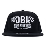 Black snapback cap showing white DBK logo and 'DIRT BIKE KIDEZ' text