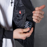 Deluxe jacket sleeve pocket with hidden phone compartment and zipper edge