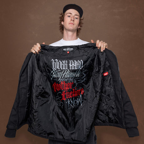Deluxe jacket with open front showing black quilted interior and graphic print