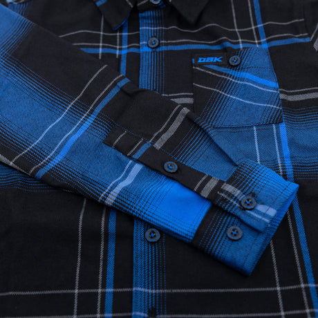 Youth flannel shirt cuff and sleeve placket in blue-and-black plaid with buttons