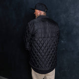 Black quilted premium jacket back view with diamond pattern and full zipper