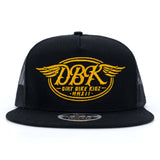 Black trucker cap with yellow DBKR wing logo centered on front, mesh side panels
