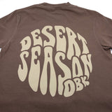 Brown womens crew-neck T-shirt with large Desert Season logo on back