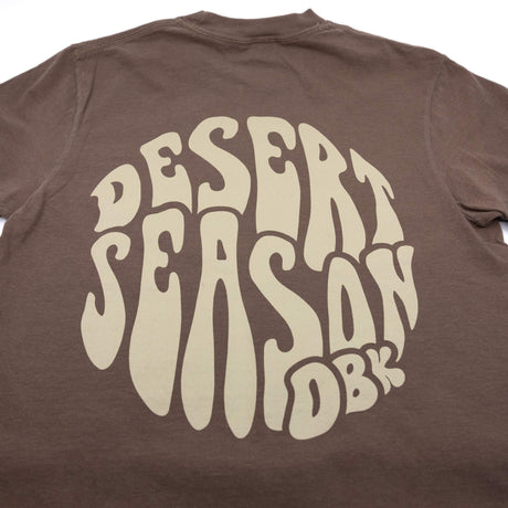 Brown womens crew-neck T-shirt with large Desert Season logo on back