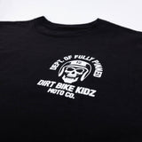 Black kids graphic tee close-up of helmet skull emblem and “Dirt Bike Kidz” text.