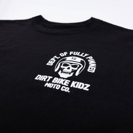 Black kids graphic tee close-up of helmet skull emblem and “Dirt Bike Kidz” text.