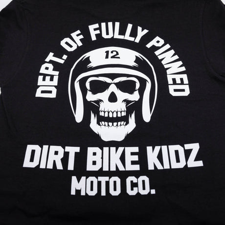 Black kids graphic tee close-up of large back skull helmet logo and “Dirt Bike Kidz.”