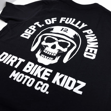 Youth premium black T-shirt back close-up showing skull helmet graphic and “DIRT BIKE KIDZ”