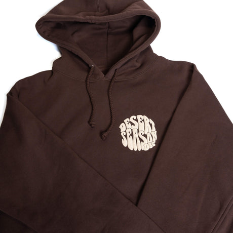 Dark brown pullover hoodie with attached hood, drawstrings, and small chest logo