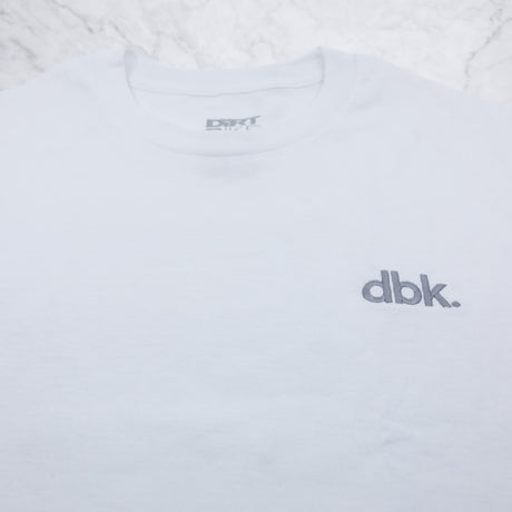 White crew T-shirt with gray dbk logo and crew neck label