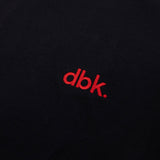 Black crew T-shirt with red dbk logo close-up