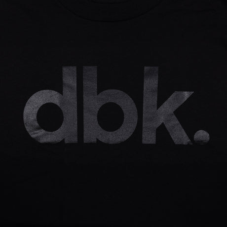 Youth premium tee, black with large dbk. logo print (close-up, lower)