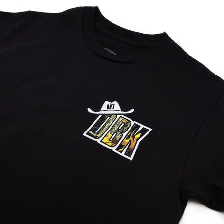 Black youth premium tee with DBK logo and AP7 mark at center chest
