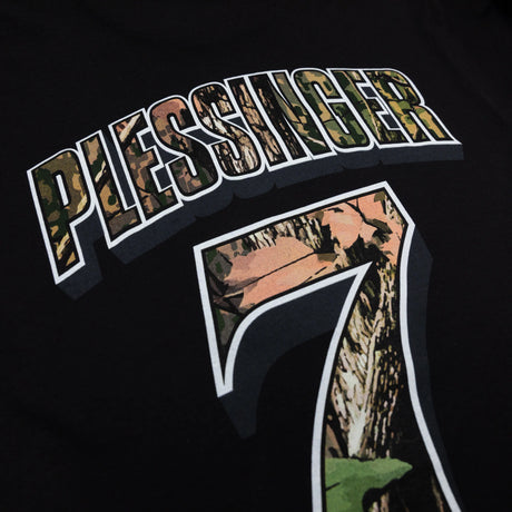 Black youth premium tee close-up of PLESSINGER 7 back graphic