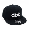 Youth snapback cap in black with white dbk logo and 4FIFTY YOUTH badge on brim
