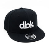 Youth snapback cap in black with white dbk logo and 4FIFTY YOUTH badge on brim