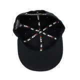 Snapback cap interior in black with 4FIFTY pattern lining and dbk branding