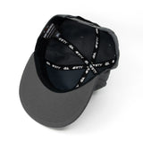 Charcoal snapback cap showing interior with black 4FIFTY and dbk logo band