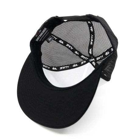 Trucker cap interior: black mesh lining with repeating "dbk" and "2FIFTY" text