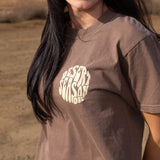 Brown womens graphic T-shirt on model, crew neck and Desert Season logo on chest