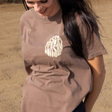 Brown womens crew-neck T-shirt with Desert Season logo printed on back