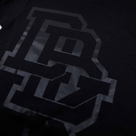 Youth premium tee, close-up of black front logo with dark gray block letters