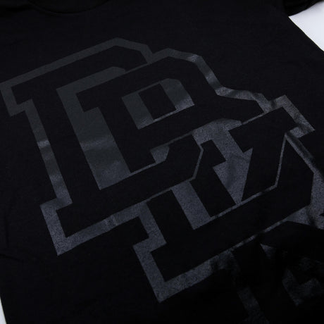Pitch Black T-shirt close-up: black with large gray letter graphic detail