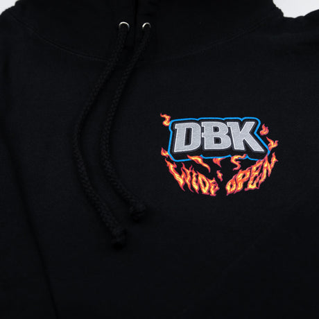 Black hoodie front chest area with DBK flame logo, close-up