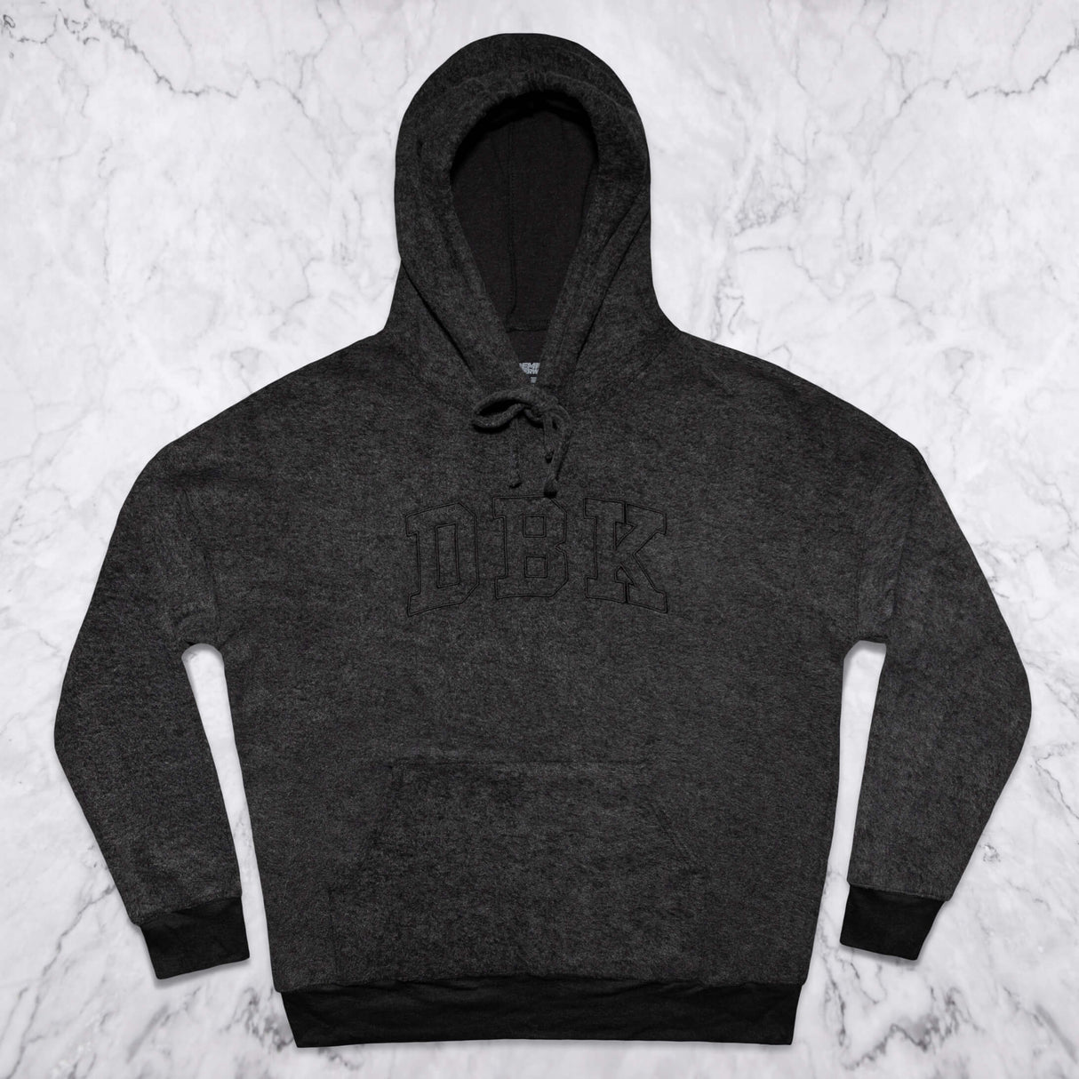 Women’s dark charcoal pullover hoodie flat lay with front logo and drawstring hood