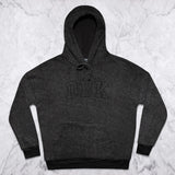 Women’s dark charcoal pullover hoodie flat lay with front logo and drawstring hood