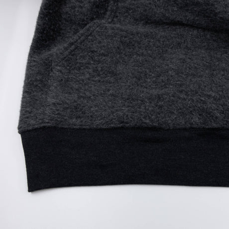 Women’s dark charcoal pullover hoodie sleeve cuff and bottom hem detail