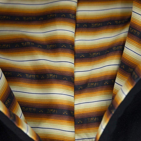 Striped hood lining in orange, yellow, brown, and navy with small icons