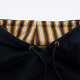 Hoodie neckline view with striped inner hood lining and navy drawcord grommets