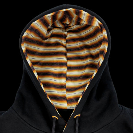 Monte Carlo hoodie on model, black pullover with logo and hood lining