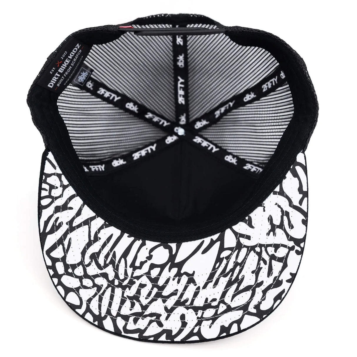 Trucker cap interior view with striped gray mesh top and logo webbing straps