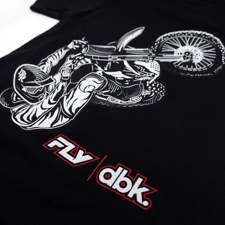 Black youth tee close-up: white wheelie print with red FLY dbk branding